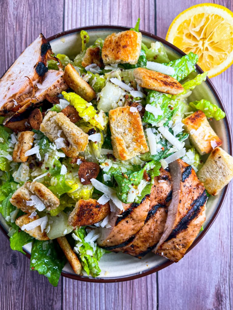 Chicken Caesar salad served fresh on a plate