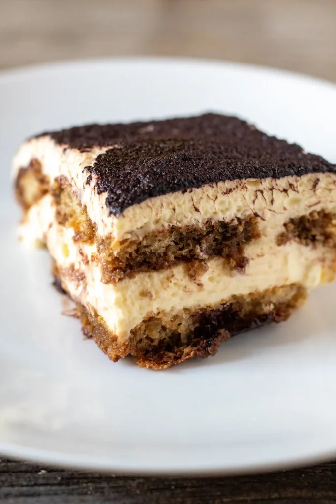 Close-up of classic tiramisu showing creamy mascarpone layers