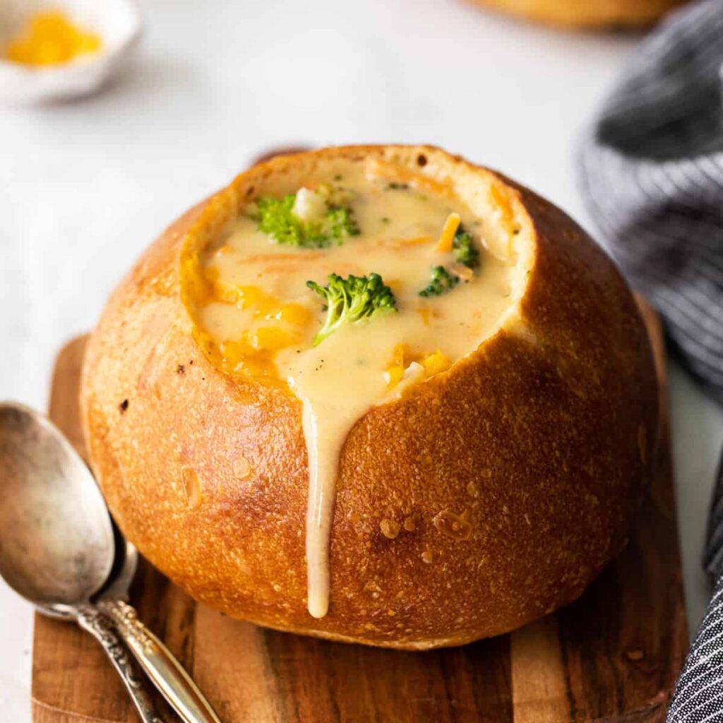 Broccoli cheddar soup topped with shredded cheddar cheese