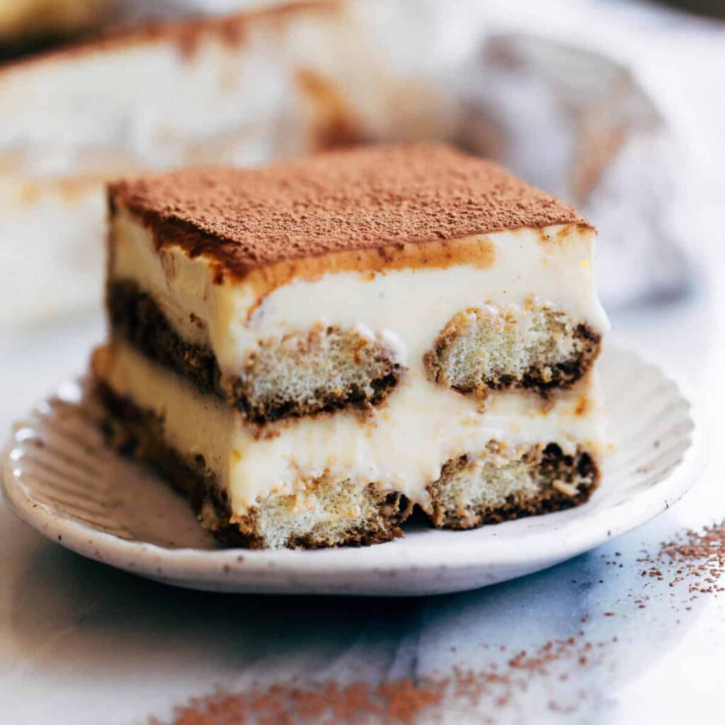 Classic tiramisu with cocoa powder and creamy layers