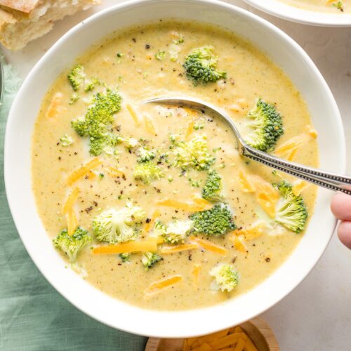 Homemade broccoli cheddar soup simmering in a pot